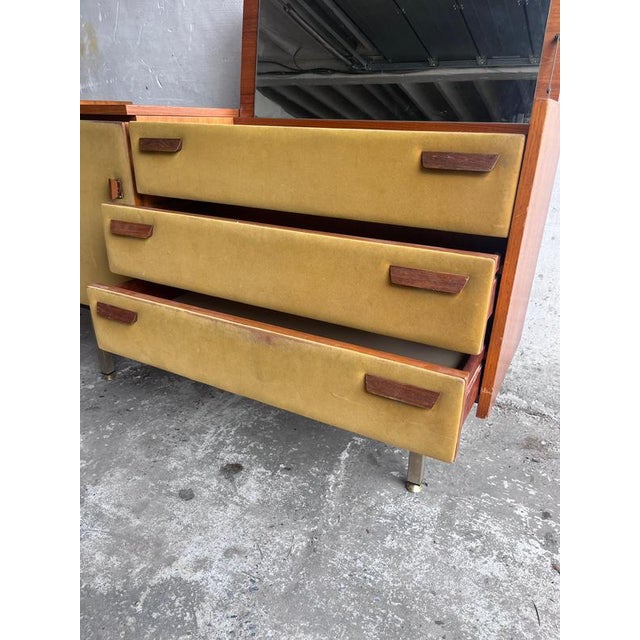 Elegant French modernist dressing table designed by Roger Landault and produced by Regy during the 1960s. The cabinet...