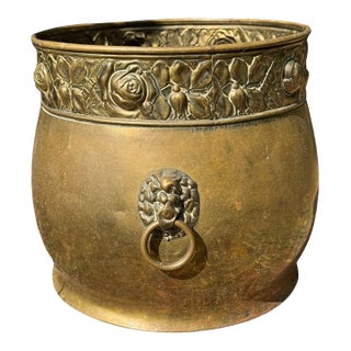 Early 20th Century Large Turn-of-the-Century Brass Jardinière Cachepot With Lion Ring Handles and Repoussé Rose Banding For Sale