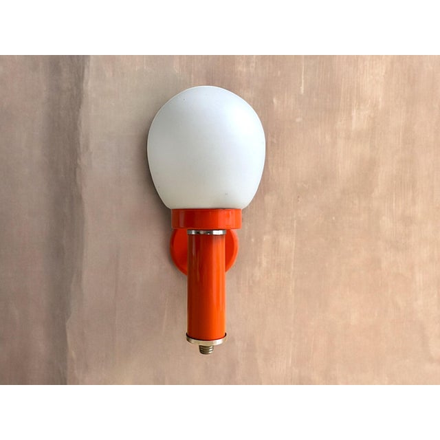 Orange Wall Sconce Lamp Mid-century wall sconce light that is meant for hard wiring. However, there is a small opening in...