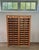 Wonderful wooden archive or filing cabinet. The cabinet has two sides, left and right, with both 14 drawers which can be...