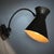 A sculptural wall lamp, which can also be used as a desk lamp, produced in Sweden in the 1940s. The piece is crafted in...