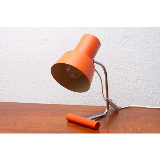 Czech modernist adjustable desk lamp by Josef Hurka for Napako. Orange lacquered metal. New wiring, plastic wire, standard...
