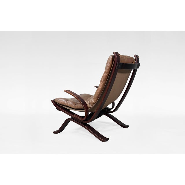 Original Focus sling-type lounge chair, manufactured by Bramin Møbler in the 1970s. The chair contains a dark brown colour...