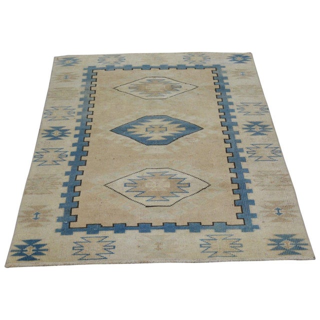 Hand-knotted with care using traditional rug-making techniques, this wool rug blends timeless craftsmanship with a modern...