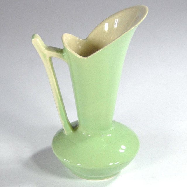 A unique, celadon ceramic jug-shaped vase. A true example of Art Deco design. Designed by Raymond Chevalier for the Boch...