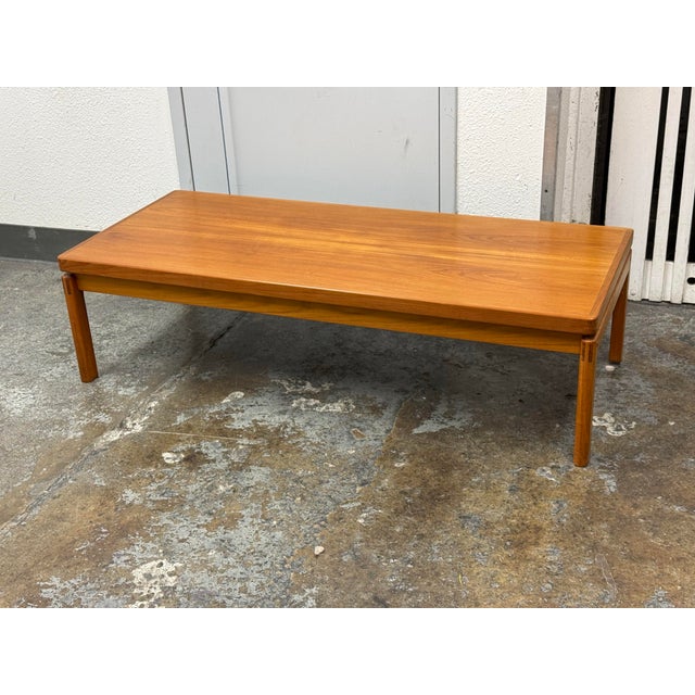 Design Plus Gallery presents a Danish Teak Wood Mid 20th Century Coffee Table. This streamlined rectangular table is made...