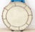 Louis XVI style round gilt wood and gesso mirror with silver leaf finish featuring acanthus leaf motif with beveled...