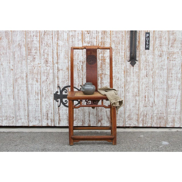 Elegant antique Chinese accent chair that is constructed in a very traditional Chinese craftsmanship and it has a carved...