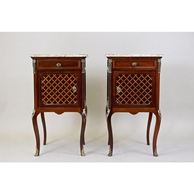 Absolutely beautiful pair of French marquetry pillar commodes/ side tables from the period in France around 1870. An...