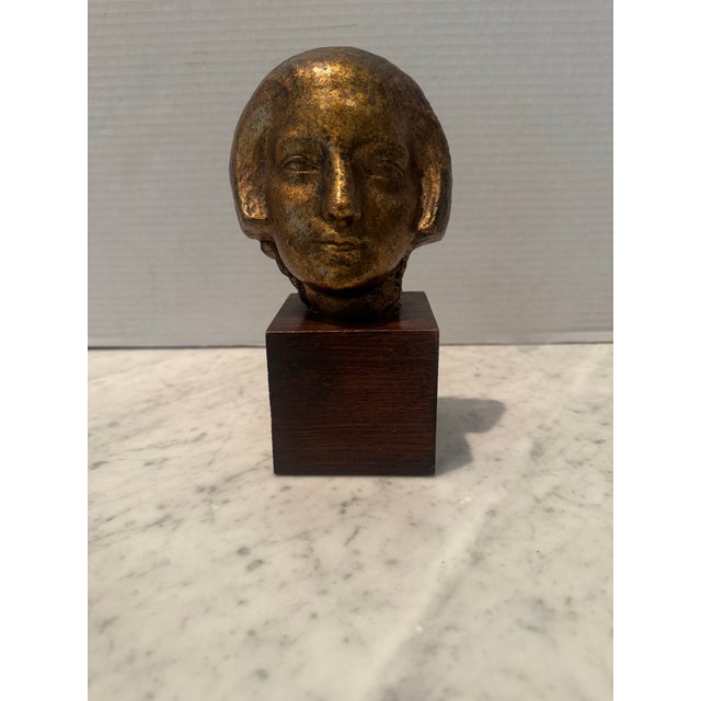 A lovely sculpture “Tete de Femme “ by French artist Albert Patrisse (French, 1892-1964). Gilt ceramic bust mounted to...