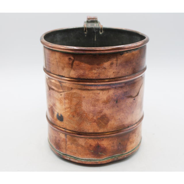 Mid-19th century copper cylinder form handled measure, English. 1/2 gallon measure. Simply delightful with warm patina,...
