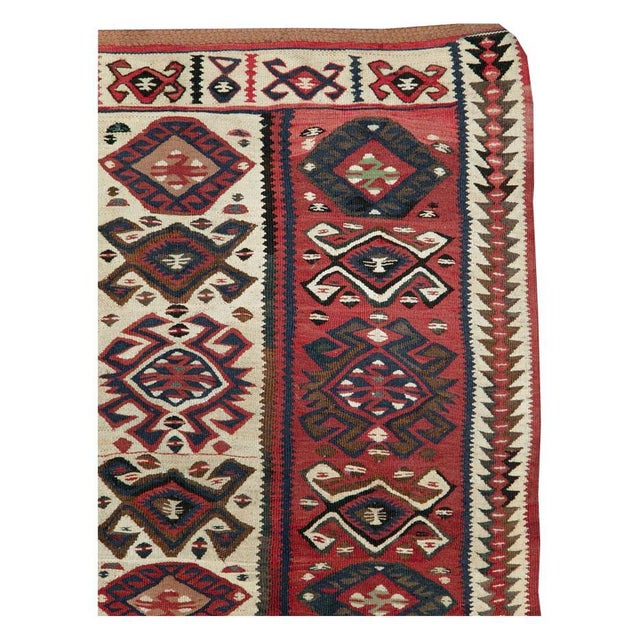 A vintage Turkish flat-weave Kilim throw rug handmade during the mid-20th century with a tribal design. Flat-weave Rugs &...