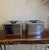 Stylish vintage pair of chrome kitchen storage canisters with streamlined mid-century styling. The canisters feature...