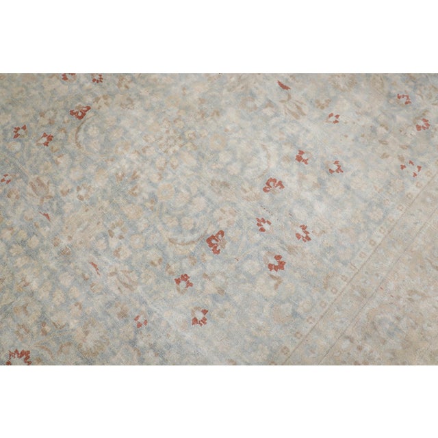 An early 20th-century washed-out persian mashad small room size rug. pops of red show up in the rug as well Details rug...