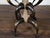 An American horn stool from circa 1880 with custom upholstery. This circa 1880 American horn stool stands as a remarkable...