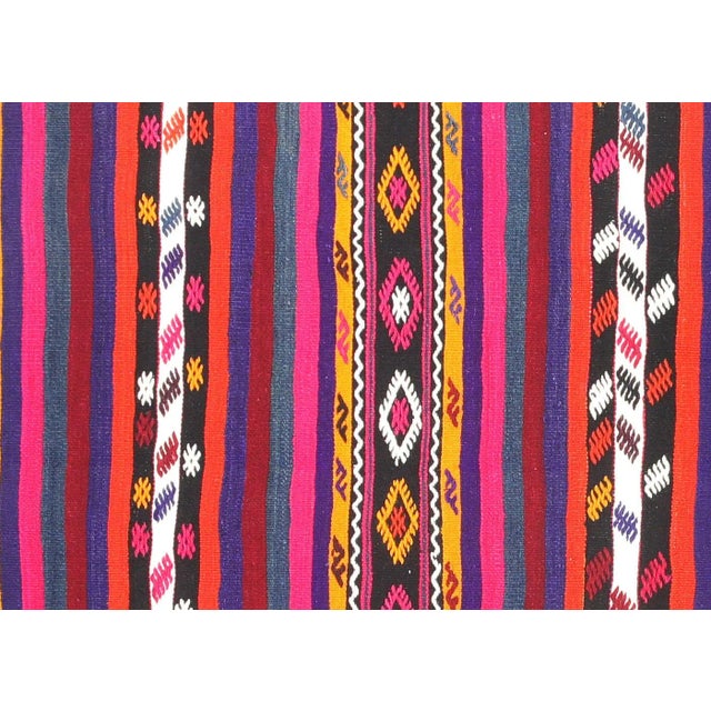 Bring a unique and traditional style to your home with this handcrafted Vintage Turkish Kilim. Boasting a classic wool-on-...