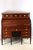 Louis XVI style cylinder desk in mahogany, 19th century. This desk rests on six legs, with a white marble top covering the...