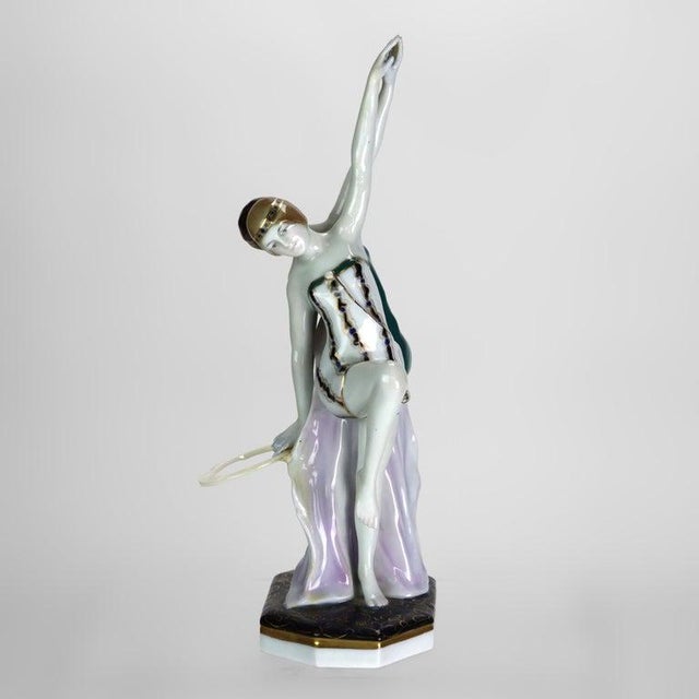 This German Art Deco porcelain figurine, crafted by Ens-Porzellan Volkstedt around 1920, depicts two dynamic female...