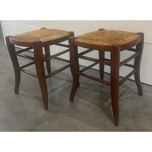 Pair of hand crafted stools with hand woven rush seats.Both in very good and sturdy condition.Great to find a matching pair.
