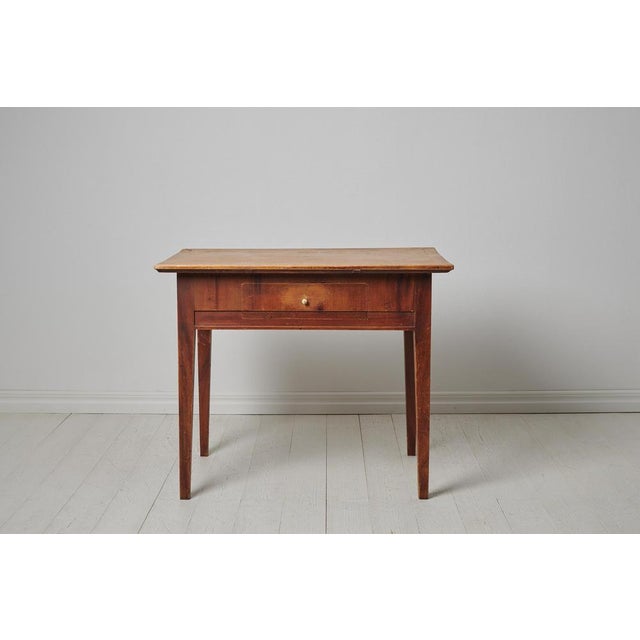 Folk art country table from northern Sweden made around 1820 to 1840 in pine. The table is an authentic Swedish country...