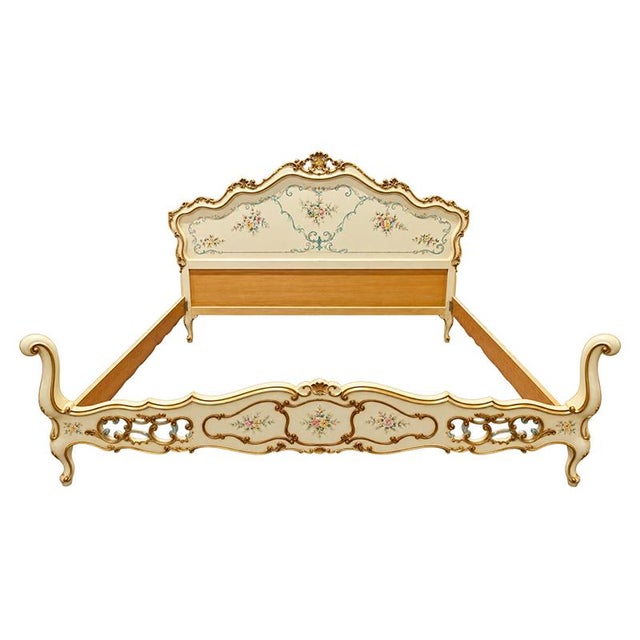 An elegant double bed in lacquered and hand-painted wood, crafted in the first half of the 20th century in Venetian style,...