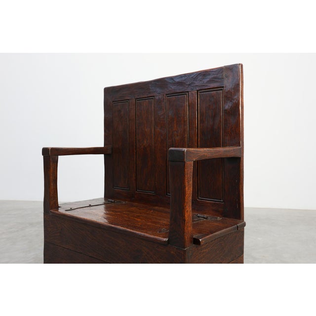 A beautifully timeworn example of rural French craftsmanship, this 19th‑century solid oak bench carries the quiet...