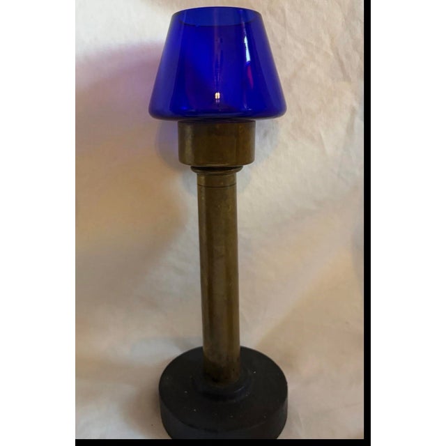 1930 Antique 5 piece brass lantern-candlestick holders with colorful glass shades. The base is heavy cast iron so it makes...