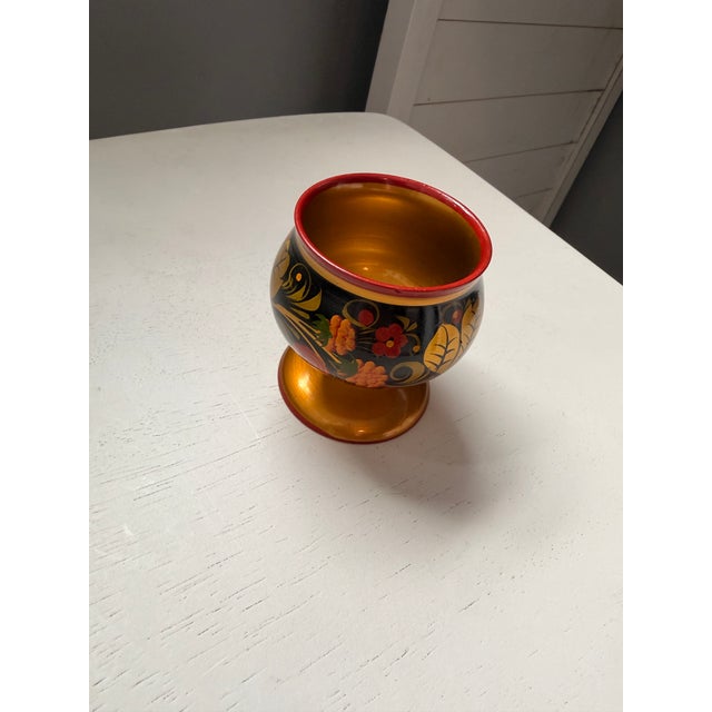 This piece features the classic “berry and leaf” motif achieved through applying a silver powder to wood and then treated...