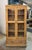 Beautifully crafted vintage wood cabinet featuring glass-paneled doors and rich natural patina. Constructed from reclaimed...