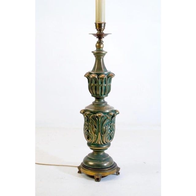 This is an unusual floor lamp from the 1930's in dark green and gold colors. The base is made in bronze and followed by...