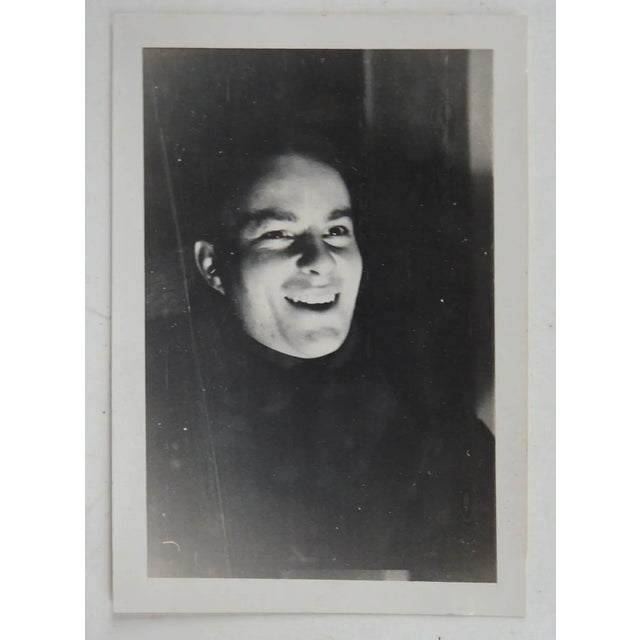 Vintage 1938 snapshot photograph. Creepy smiling head without body. Ellison Photo Service Austin Texas 1938 stamp on back,...