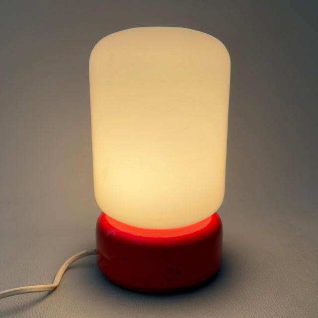 An iconic and vibrant pop of color to brighten up your spaces with the radical charm of vintage design. This rare table...