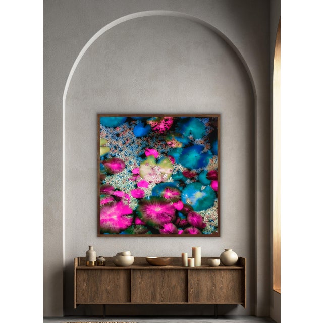 Vibrant bursts of pink, blue, and green floating together like scattered confetti on water, perfect for adding a pop of...