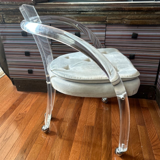 An exceptional 1970s Mid-Century Modern Lucite rolling tub armchair, widely attributed to Charles Hollis Jones / Hill...