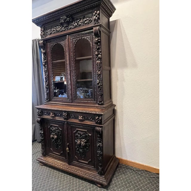 This exquisite 19th century French Normandy ebony oak hutch showcases masterful hand-carved floral and fruit motifs,...