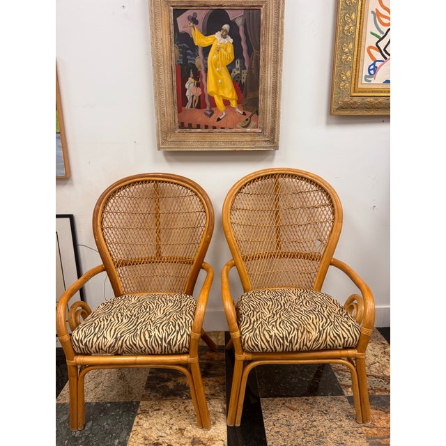 ⸻ Title: Pair of 1970s Rattan Lounge Chairs with Zebra Upholstery (Two Pairs Available) Description: Vintage 1970s rattan...