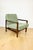 Vintage brown wooden armchair with green-olive jeans upholstery, designed by Z. Bączyk. 2 pieces available. A 1970s...