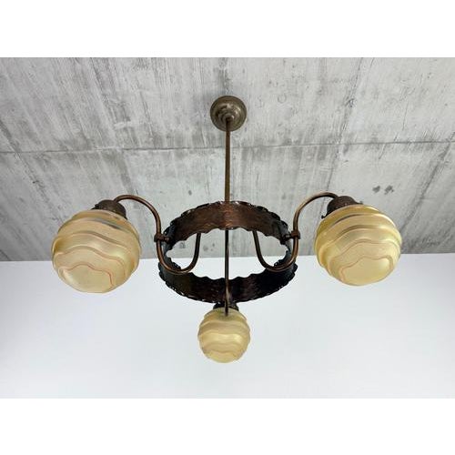A highly atmospheric and rare three-light Art Deco chandelier, crafted in Central Europe (Czechoslovakia) during the...