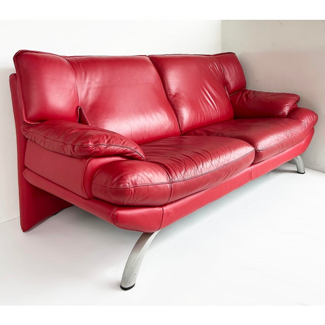 Contemporary Italian Red Leather Love seat, Metal Legs Offered for sale is a sumptuous contemporary bright red leather...