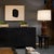 This modern side table has a minimalist form with clean lines and timeless materials. Crafted from reclaimed elm with a...