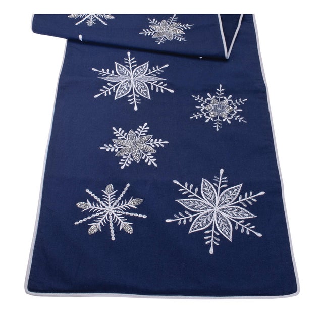 Add a touch of winter elegance to your home with the Embroidered Snowflake Table Runner. This beautiful table runner...