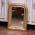This refined antique French Louis Philippe wall mirror, crafted circa 1870, features the understated elegance and softly...