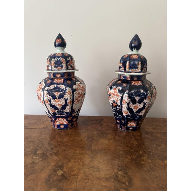 Quality large pair of antique Japanese imari lidded vases, having a quality pair of antique Japanese imari lidded vases...