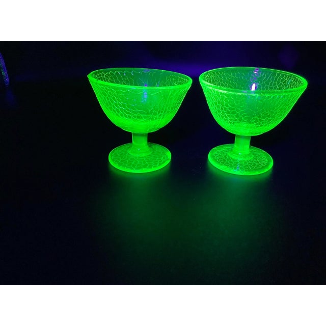A lovely set of two antique crackle yellow canary vaseline glass sherbet cups. The darker yellow dish has a small chip in...