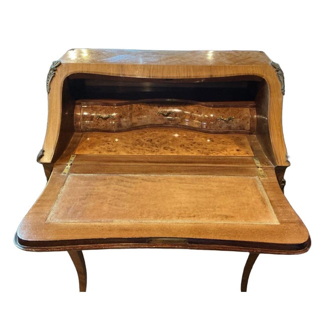 Beautiful antique Italian Louis XVI style secretary/desk with walnut marquetry and ormolu. Features a design of...
