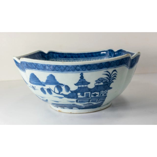 We are selling this large 19th century Chinese export Canton decorated Blue and White bowl. This bowl with cut corners is...