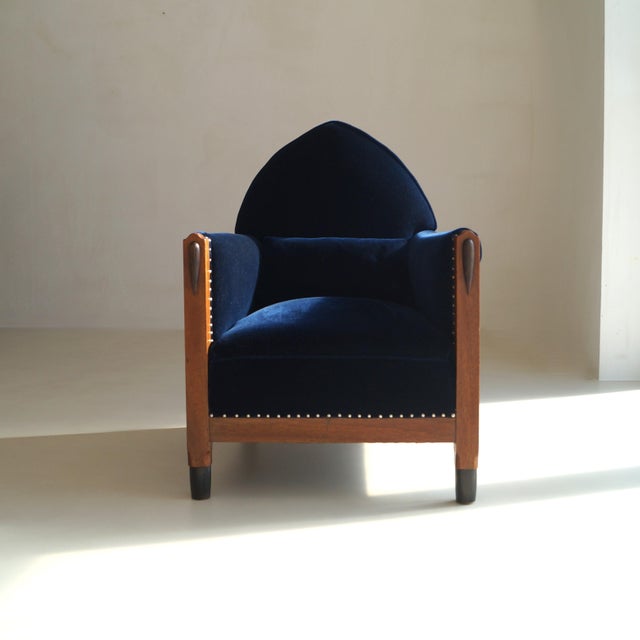 A monumental Amsterdam School armchair, restored with precision and reintroduced for contemporary living. This piece...