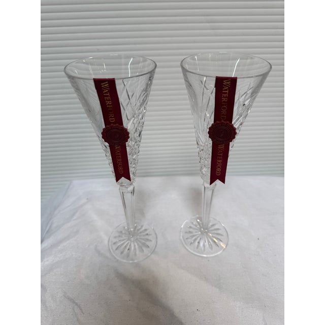Design Plus Gallery presents a Pair of Twelve Day of Christmas Champagne Flutes in Individual Boxes from Waterford. The...