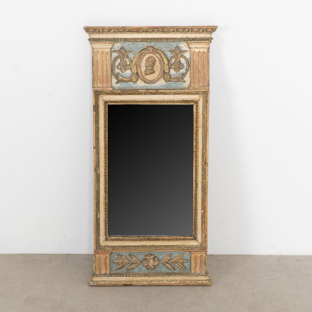 Lovely decorative trumeau mirror with applied carved accents including a man's bust/profile, decorative flourishes, flower...