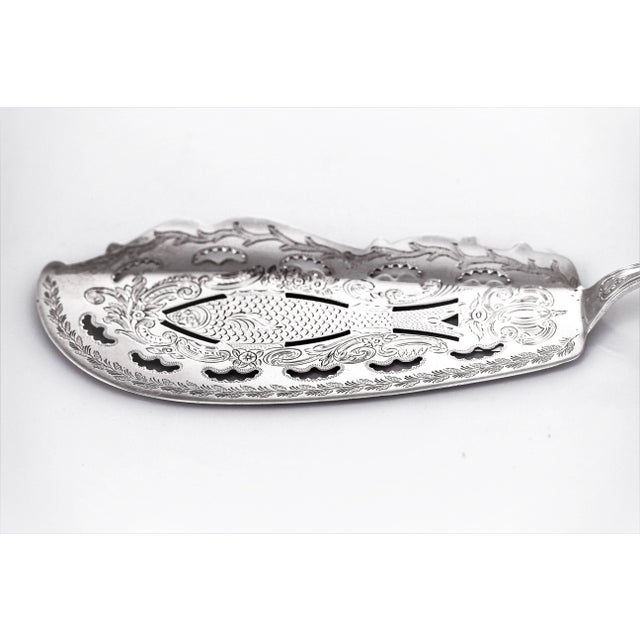The fish server is just exquisite, a work of art! One side is smooth and rounded while the other is scalloped and slightly...